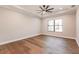 Bright bedroom with hardwood floors and ceiling fan at 2073 Treasure Ln, Punta Gorda, FL 33982