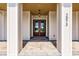 Inviting front entry with double doors and a covered porch at 2073 Treasure Ln, Punta Gorda, FL 33982