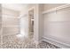Spacious walk-in closet with ample shelving and geometric tile floor at 2073 Treasure Ln, Punta Gorda, FL 33982