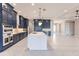 Modern kitchen with white quartz island, navy blue cabinetry, and gold accents at 2073 Treasure Ln, Punta Gorda, FL 33982