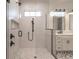 Walk-in shower with marble tile and glass enclosure at 2073 Treasure Ln, Punta Gorda, FL 33982