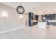 Spacious dining room with modern light fixture and kitchen access at 2073 Treasure Ln, Punta Gorda, FL 33982
