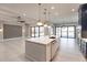 Open concept kitchen with white island and dark blue cabinetry at 2073 Treasure Ln, Punta Gorda, FL 33982