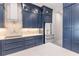 Modern kitchen with navy blue cabinets and geometric backsplash at 2073 Treasure Ln, Punta Gorda, FL 33982