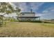 Country home with large porch and expansive lawn at 48665 Bermont Rd, Punta Gorda, FL 33982