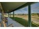 Relaxing porch with rocking chairs overlooking the property at 48665 Bermont Rd, Punta Gorda, FL 33982
