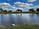 Serene pond with ripples and a stone bench at 48665 Bermont Rd, Punta Gorda, FL 33982