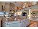 Spacious living area with high ceilings, stone fireplace, and hardwood floors at 48665 Bermont Rd, Punta Gorda, FL 33982
