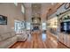 Open living room with high ceilings and a large stone fireplace at 48665 Bermont Rd, Punta Gorda, FL 33982