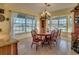 Bright dining room featuring a large table and window views at 48665 Bermont Rd, Punta Gorda, FL 33982