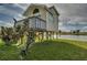 Elevated guest house with a deck overlooking a pond at 48665 Bermont Rd, Punta Gorda, FL 33982