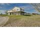 Two-story home with stone accents and a large front porch at 48665 Bermont Rd, Punta Gorda, FL 33982