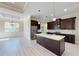 Modern kitchen with granite countertops and dark cabinetry at 4209 Titan St, North Port, FL 34286