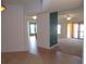 Bright hallway with tile flooring offering views into the living and dining areas at 97 Vivante Blvd # 9749, Punta Gorda, FL 33950