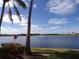 Serene lakefront view with lush landscaping at 97 Vivante Blvd # 9749, Punta Gorda, FL 33950