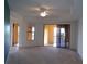 Living room with carpeted floor, access to balcony and window views at 97 Vivante Blvd # 9749, Punta Gorda, FL 33950