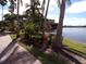 Brick walkway leading to a picturesque lake view at 97 Vivante Blvd # 9749, Punta Gorda, FL 33950