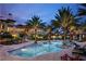 Inviting community pool area at night at 97 Vivante Blvd # 9749, Punta Gorda, FL 33950