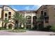 Mediterranean-style building with multiple levels and lush landscaping at 97 Vivante Blvd # 9749, Punta Gorda, FL 33950