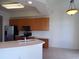 Modern kitchen with stainless steel appliances and wood cabinets at 97 Vivante Blvd # 9749, Punta Gorda, FL 33950