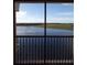 Balcony offering serene lake and fountain views at 97 Vivante Blvd # 9749, Punta Gorda, FL 33950