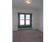 Bedroom with neutral carpeting and a large window at 97 Vivante Blvd # 9749, Punta Gorda, FL 33950