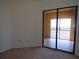 Bedroom with sliding doors to a balcony overlooking water at 97 Vivante Blvd # 9749, Punta Gorda, FL 33950