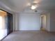 Bright living room with sliding glass doors leading to a balcony at 97 Vivante Blvd # 9749, Punta Gorda, FL 33950