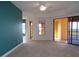 Spacious living room with carpeting, access to a balcony, and views at 97 Vivante Blvd # 9749, Punta Gorda, FL 33950