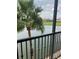 Balcony overlooking the lake and palm trees at 97 Vivante Blvd # 9749, Punta Gorda, FL 33950