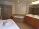 Large bathroom with double sinks, tub and shower at 97 Vivante Blvd # 9749, Punta Gorda, FL 33950