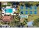 Overhead view of community amenities, including a swimming pool, tennis courts, and shuffleboard at 3006 Caring Way # 325, Port Charlotte, FL 33952