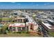 Sprawling condominium complex aerial view, featuring a well-manicured lawn, parking and many windows at 3006 Caring Way # 325, Port Charlotte, FL 33952