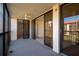 Enclosed balcony boasts access to the living room with sliding glass doors and railings at 3006 Caring Way # 325, Port Charlotte, FL 33952