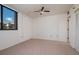Bright bedroom features neutral carpeting, and lots of natural light from a large window at 3006 Caring Way # 325, Port Charlotte, FL 33952