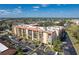 A condo exterior with ample parking and many large windows offers a great location and bright units at 3006 Caring Way # 325, Port Charlotte, FL 33952