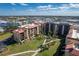 Condo exterior boasts well-manicured landscaping, sidewalks, and convenient access to parking at 3006 Caring Way # 325, Port Charlotte, FL 33952