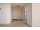 Hallway with view of a small kitchen through a doorway and a closet on the left at 3006 Caring Way # 325, Port Charlotte, FL 33952