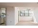 Bright, open living room with an adjacent kitchen view at 3006 Caring Way # 325, Port Charlotte, FL 33952