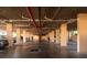 Underground parking garage featuring assigned parking, bright lighting, and overhead pipes at 3006 Caring Way # 325, Port Charlotte, FL 33952