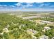Aerial view of the home's location surrounded by lush greenery, highlighting its peaceful and private setting at 3482 Dunkirk St, Port Charlotte, FL 33980