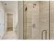 Bathroom featuring a tiled walk-in shower with glass partition at 3482 Dunkirk St, Port Charlotte, FL 33980
