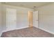 Bedroom with neutral carpet and trim, featuring two entries and a closet at 3482 Dunkirk St, Port Charlotte, FL 33980