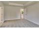 Cozy bedroom features neutral paint, soft carpeting, and ample natural light at 3482 Dunkirk St, Port Charlotte, FL 33980