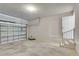 Garage with concrete floor and white door to interior at 3482 Dunkirk St, Port Charlotte, FL 33980