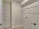 Laundry room with tile floors and wire shelving at 3482 Dunkirk St, Port Charlotte, FL 33980