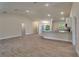 Open-concept living space with wood-look tile floors, neutral paint, and recessed lighting at 3482 Dunkirk St, Port Charlotte, FL 33980