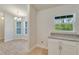 Walk-in pantry with custom cabinets and granite countertop, offering ample storage space at 3482 Dunkirk St, Port Charlotte, FL 33980