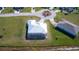Aerial view of house with pool and backyard, situated on a spacious lot at 7417 S Moss Rose, Punta Gorda, FL 33955