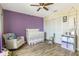 Bedroom with crib, seating, and built-in closet at 470 Ridgecrest Dr, Punta Gorda, FL 33982